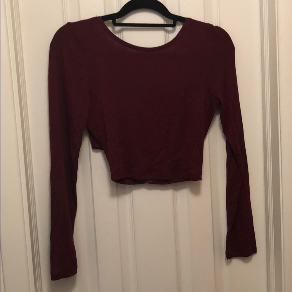 Maroon crop top with open back.